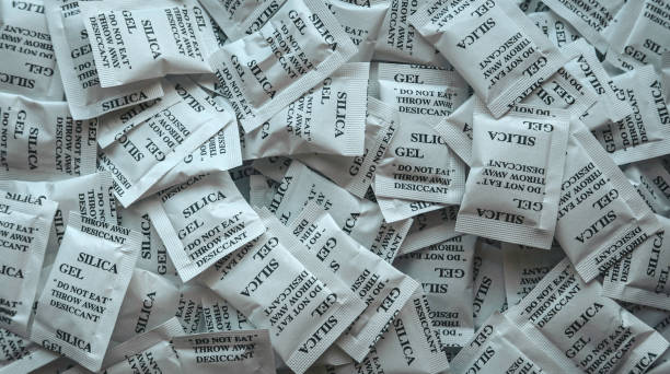 What happens when silica gel gets wet / absorbs water? Why does it get warm?